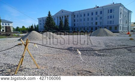 Pile Of Rubble Near Residential Building In City Center. Construction Site. Civil Engineering. Const
