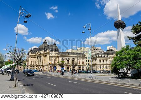 Bucharest, Romania, 6 May 2021: The Central University Library With Equestrian Monument To King Caro