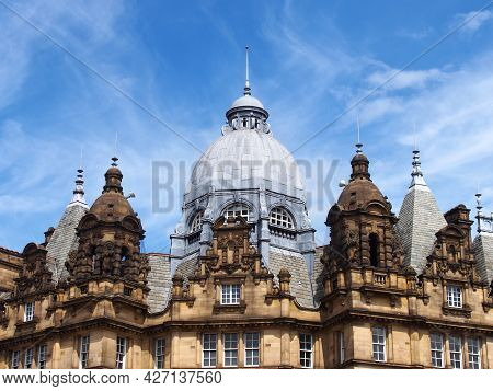 Ornate Stone Towers And Domes On The Roof Of Leeds City Market A Historical Building In West Yorkshi
