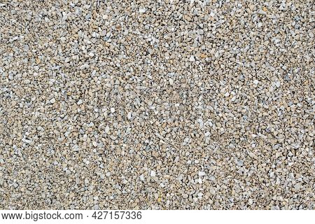 Dry White Limestone Ballast Flat Full Frame Background. Small Gray Dusty Broken Macadam Stones Textu