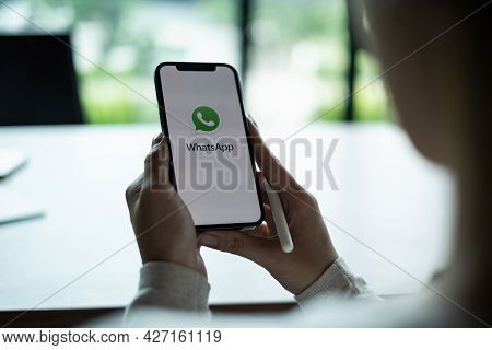 Chiang Mai, Thailand - July 15 2021 : Man Holding A Iphone And Open Appstore Searching Social Intern