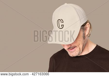 Man in beige cap with C logo for men's apparel shoot