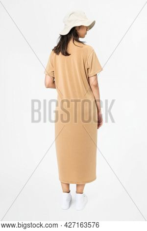 Woman in beige t-shirt dress and bucket hat casual wear apparel