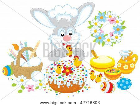 Easter bunny decorates a fancy cake