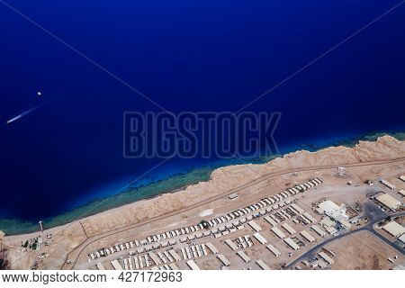 View From The Airplane Window Of The Mountains And Sea Resort Of Egypt
