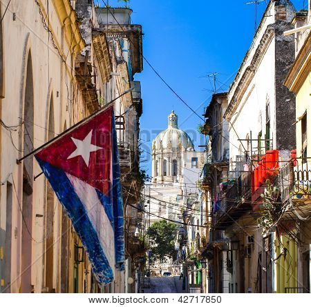 HAVANA, CUBA - DECEMBER 18, 2012: National flag from cuba with view of the capitol in cuba havana