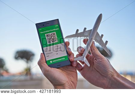 Smartphone Displaying On App Mobile Valid Digital Green Vaccination Certificate For Covid-19 And Air