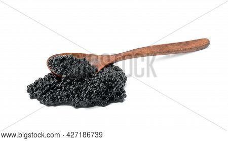 Fresh Grainy Black Paddlefish Caviar In Brown Wooden Spoon On White Background, Close Up