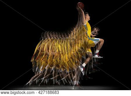 Young Caucasian Basketball Player In Motion And Action Isolated On Dark Background With Stroboscope 