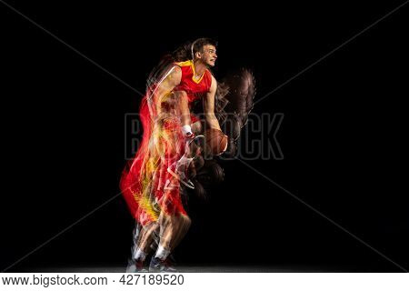 Professional Basketball Player Playing Basketball Isolated On Dark Background With Stroboscope Effec