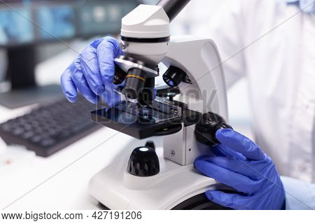 Pharmacist Woman Doctor Analyzing Coronavirus Dna Test Using Medical Microscope Working In Microbiol