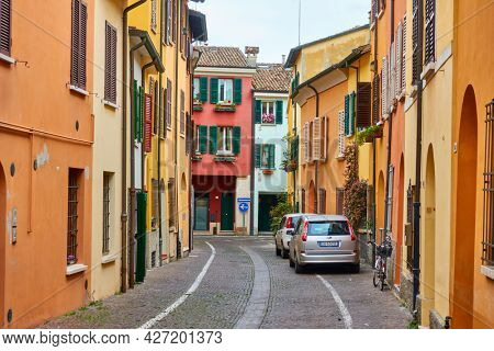 Cesena, Italy -  February 27, 2020: Street with colorful old dwelling houses in Cesena, Emilia-Romagna. Italian cityscape