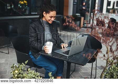 Mirthful Young Lady Having Good Time At The Cafe Terrace