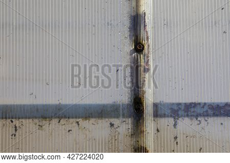 Old Polycarbonate Greenhouse Sheet. Cellular Polycarbonate Sheet In Poor Condition After A Long Serv