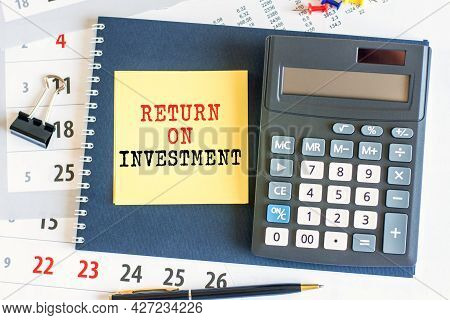 Yellow Piece Of Paper With The Text Return On Investment On The Desk, Selective Focus