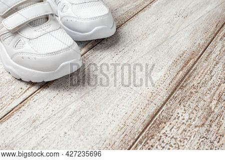 A Pair Of Childrens Leather Sports Sneakers Sewn With A Fabric With A Velcro Closure, With A Shoe Ly