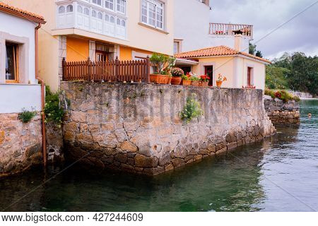 View of the characteristic colored houses overlooking the sea in a north village 