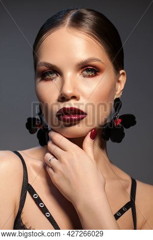 Adalt Model With Professional Make Up And Trendy Hairstyle
