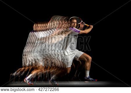 Power And Speed. Young Man, Professional Tennis Player In Motion And Action Isolated On Dark Backgro