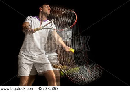 Portrait Of Young Man, Male Tennis Player In Motion And Action Isolated On Dark Background. Strobosc