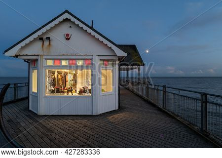 A View Of Southwold Pier At Sunset On A Cold Autumn Evening
