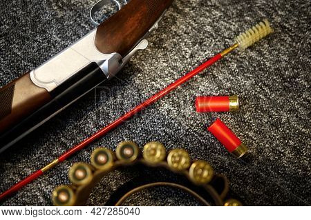 Hunting rifle, bandolier and ramrod in gun store