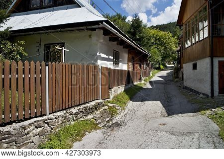 Spania Valley, Slovakia: A Typical Alley Between Older Houses In The Mining Village Spania Valley.