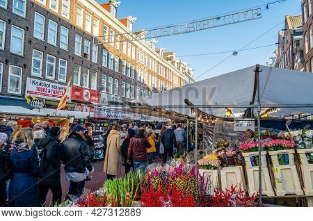 Amsterdam, The Netherlands - November 17, 2018: People Visiting The Albert Cuyp Market, A Street Mar