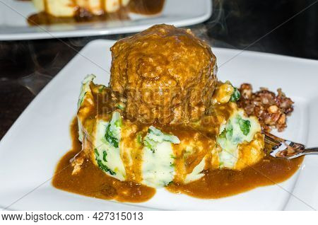 A Dish Of Dutch Meatballs (gehaktballen) Served With Mashed Potatoes