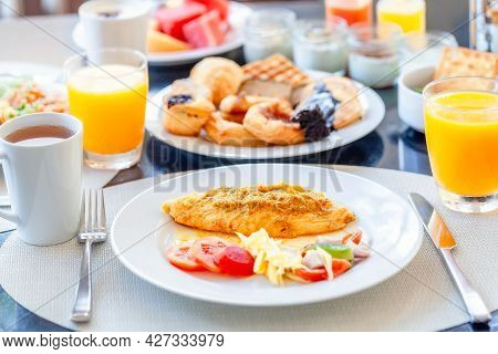 Breakfast Buffet In Luxury Hotel, Omelette And Fresh Desserts, Buns, Croissant. Dining Table With Pl