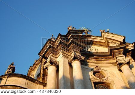 Dominican Church Central Facade At Summer Sunset On Clear Sky. Architecture Of Old Lviv City In Ukra
