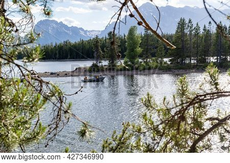 Wyoming, Usa - June 26, 2021: A Family On A Boat In Colter Bay In Grand Teton National Park, On Jack