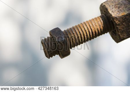 Old Rusty Bolt, Iron Rod With Screw Threads. Rusted Mechanical Components. Threaded Bolt And Nut Iso