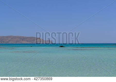 Paradise Lagoon, Turquoise Sea Water And Cloudless Sky.