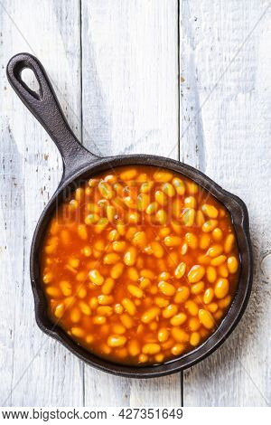 Baked beans, classic american staple food served in a skillet