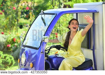 Smiling Amazed Young Woman Draver In Electro Car. Saving Ecology. Electric Cars.