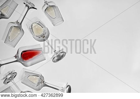 Glasses With Delicious Wine On White Background, Flat Lay. Space For Text
