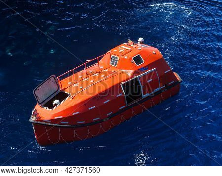 Offshore Life boat or survival craft at muster station of oil and gas drilling rig