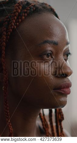 Close-up Of African Woman Meditating In Lotus Position Sitting On Yoga Mat With Closed Eyes At Home 