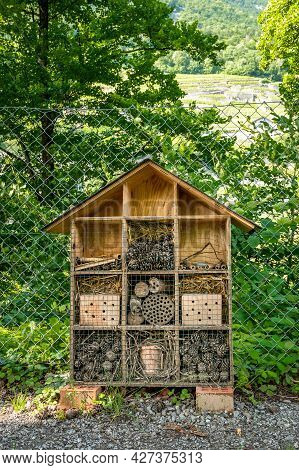 Wooden Insect House In The Garden. Bug Hotel In Natural Environment. Insect Hotel In Switzerland. Sh