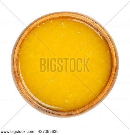Freshly Pressed Orange Juice With Fruit Pulp In A Wooden Bowl. Freshly Squeezed Orange-juice, A Swee