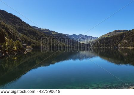 Marmorera Lake On A Bright Summer Day Under Clear Blue Sky. Julier Pass, Grisons, Switzerland
