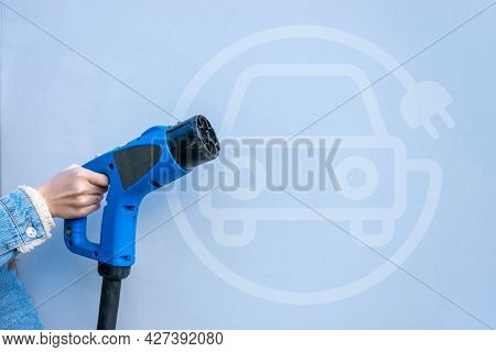 Electric Car Charging Station. Power Cable Pump Plug In Recharge Fuel Technology With Cable To Power