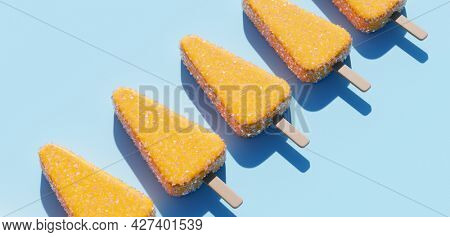 Lemon popsicles background. Fruity ice pop, ice cream treat