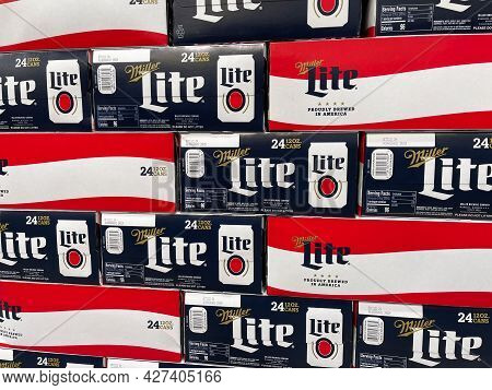 Cases Of Cans Of Miller Lite Beer At A Grocery Store Waiting For Customers To Purchase.