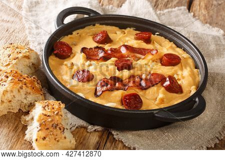 Rustic Gacha Manchega Porridge Made From Pea Flour With Paprika And Garlic, Bacon And Chorizo Close-