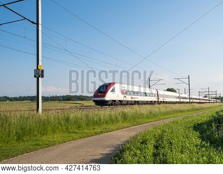 Swiss Tilting Train Sbb Icn Rabde 500 Passing Through Countryside On June 11, 2021 In Niederbipp, Sw