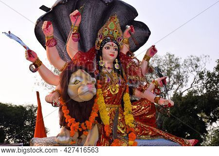 Background Durga Puja Festival And Tableau. Sculpture Of Hindu Goddess Durga