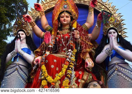 Background Durga Puja Festival And Tableau. Sculpture Of Hindu Goddess Durga