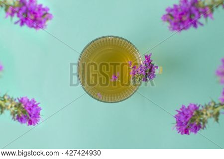 Cup Of Tea With Willow-herb On Mint Wooden Background.herbal Tea From Fermented Kipreya Leaves. Trad